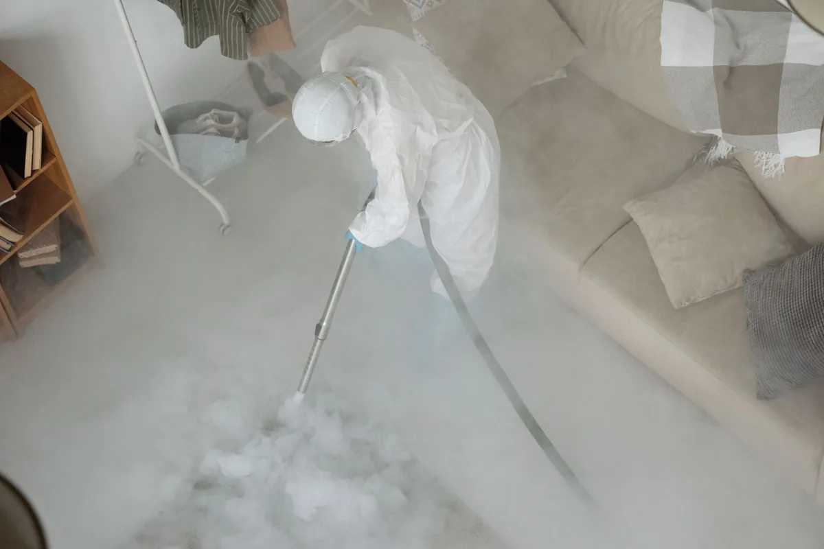 Biohazard cleanup technician in protective equipment, Three Rivers, TX